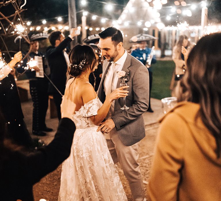 Bride and groom dance outside with sparklers to the mariachi band wedding entertainment