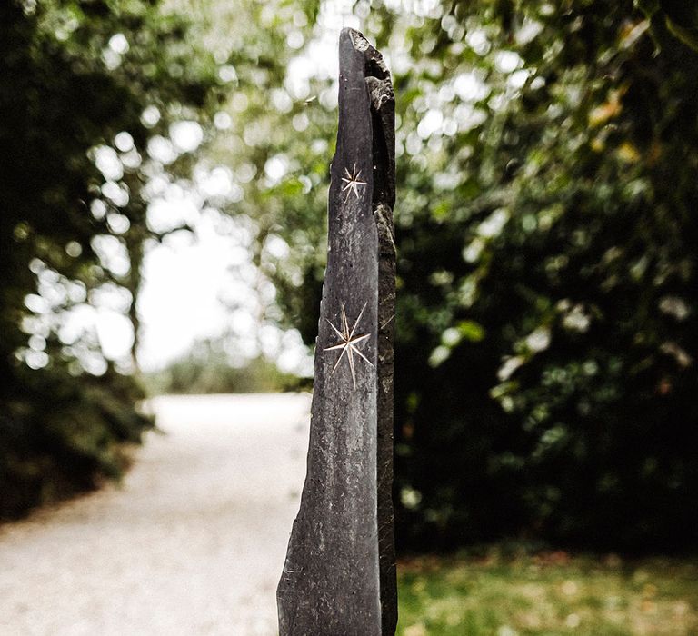 Treseren entrance with engraving on rock