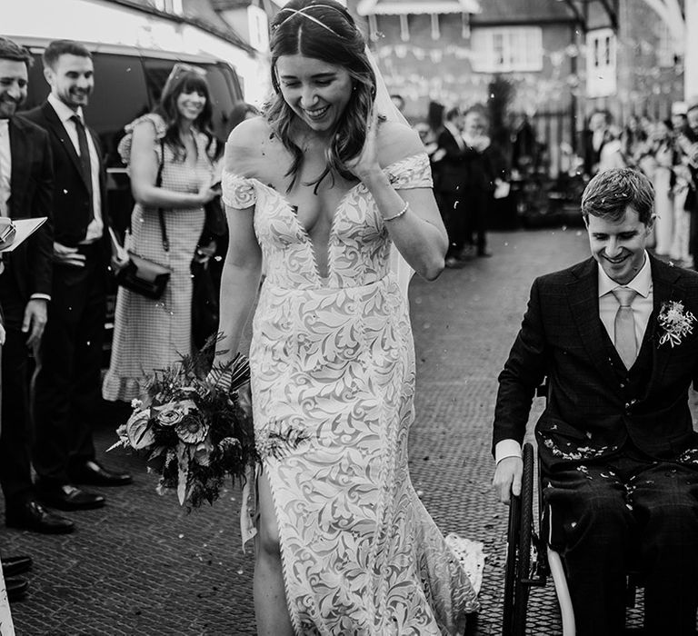 Bride and groom exit their wedding ceremony to confetti for their Henley Brewery wedding