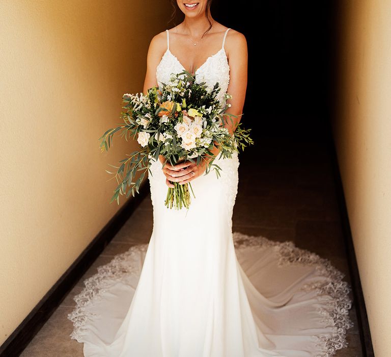 Bride in a lace wedding dress with a train 