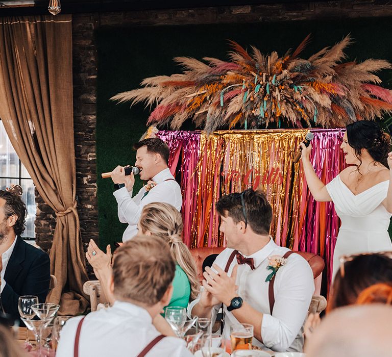 The bride and groom perform in their band, Tux Fizz, for the entertainment 