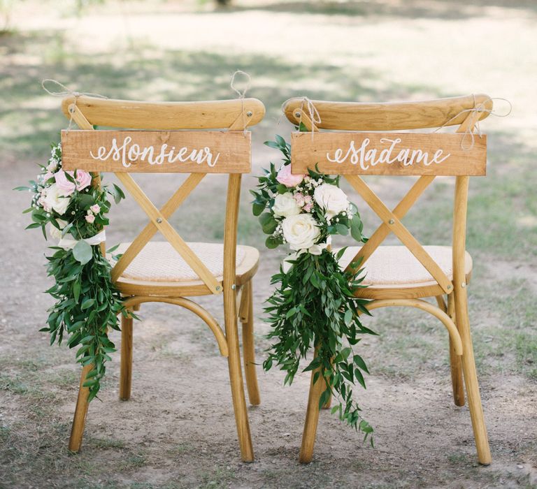 Wooden sign wedding chair decor with pink and white roses and gypsophila for outdoor summer wedding in France 