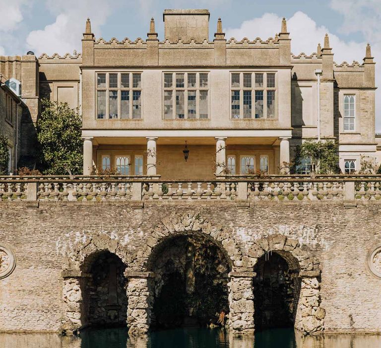 Exterior of Euridge Manor wedding venue with lake and water feature 