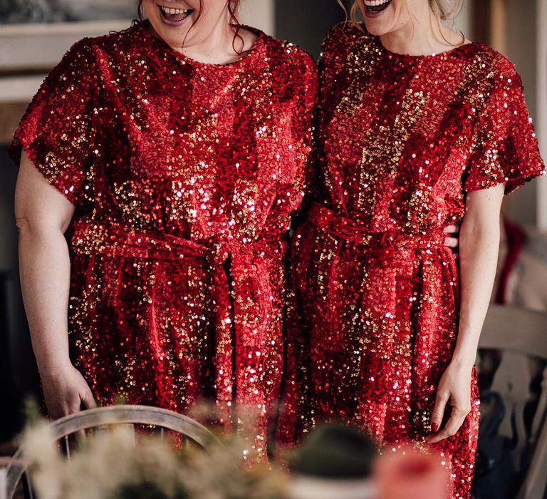 Bridesmaids wear red sequin midi bridesmaid dresses for carnival theme wedding 