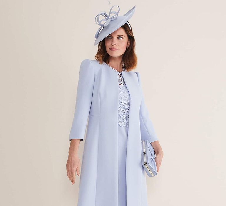 Mother of the bride longer length pale blue jacket with a decorative bow 