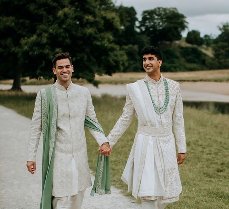 Two grooms in light green and champagne gold sherwani wedding outfits for Hindu wedding 