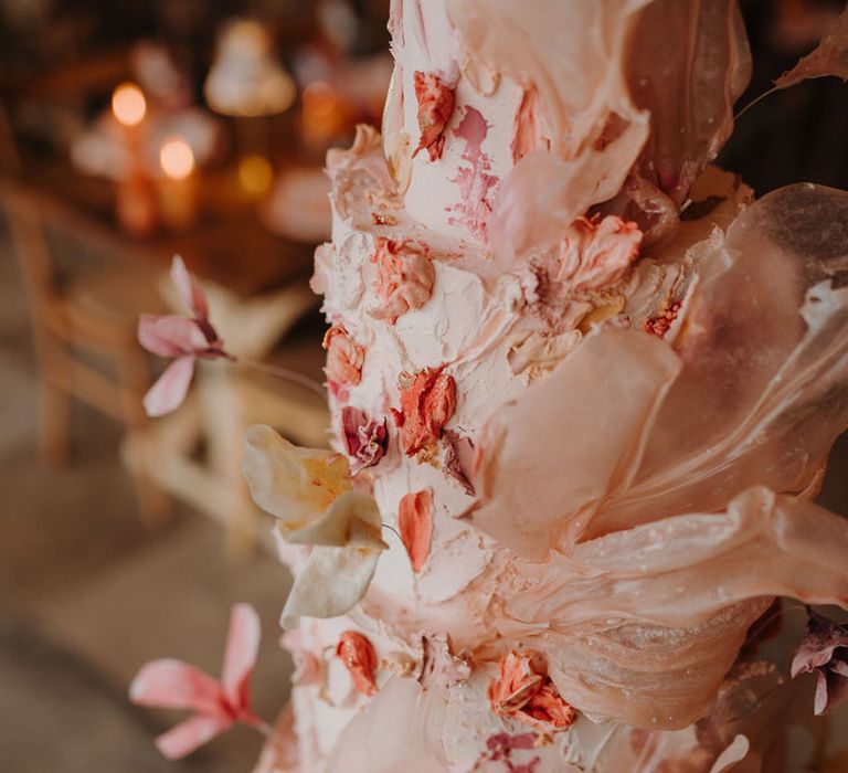 Stunning detail on wedding cake with handpainted design and handcrafted flowers 