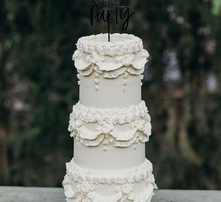 Three tier retro wedding cake with custom cake topper 