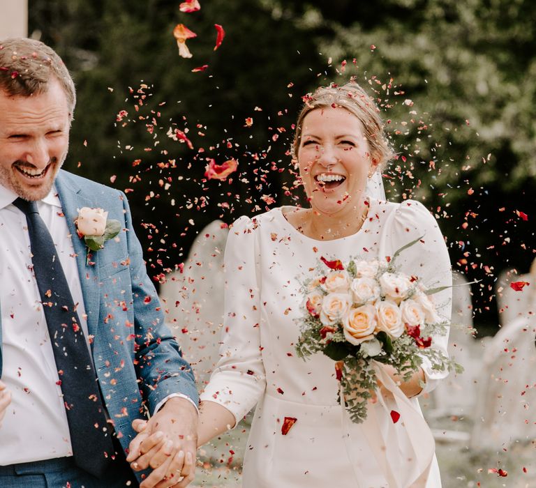 Confetti moment for bride and groom