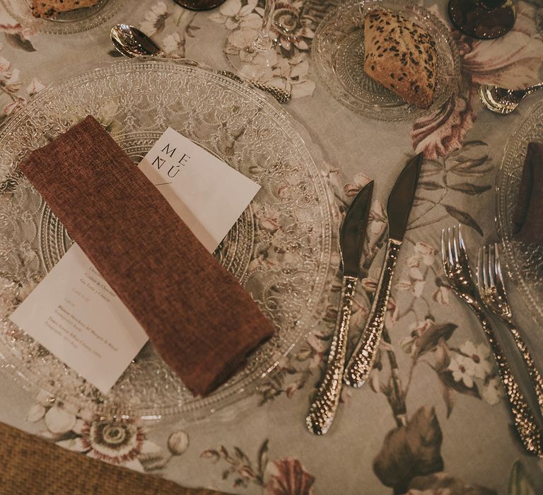 place setting with glass charger place and napkin 