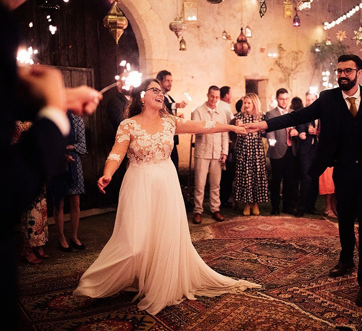 Bride and groom at celebration with Moroccan themed wedding decor