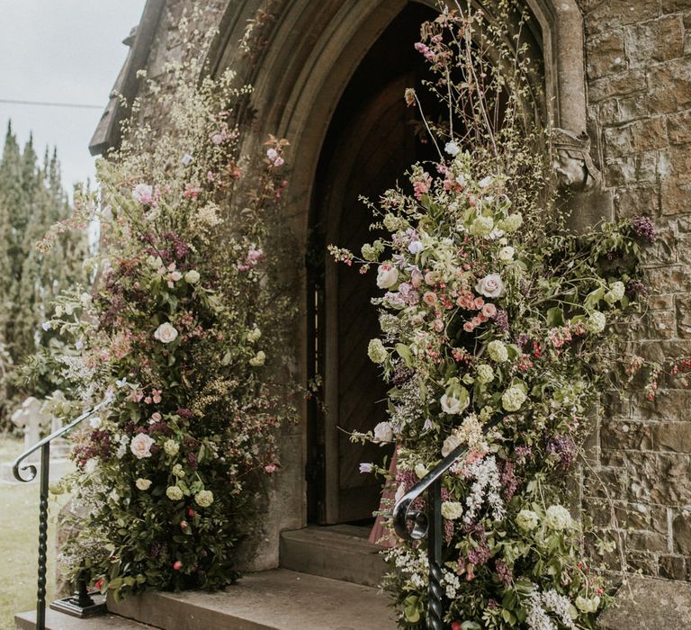 Wedding flowers decorating the church entrance