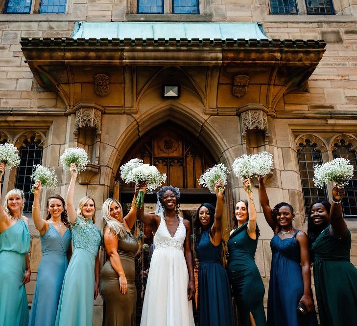 Bridesmaids in different green dresses 