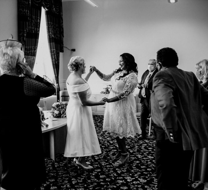 Newly-wed brides celebrating at their Liverpool wedding ceremony 