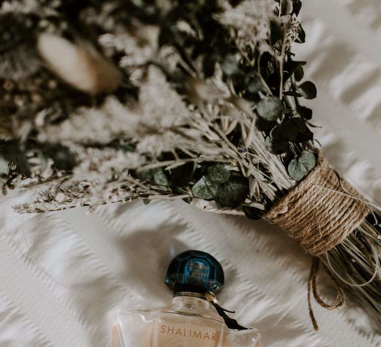 Bouquet of dried flowers with the perfume worn by the bride 