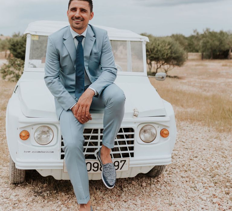 Groom in pale blue wedding suit