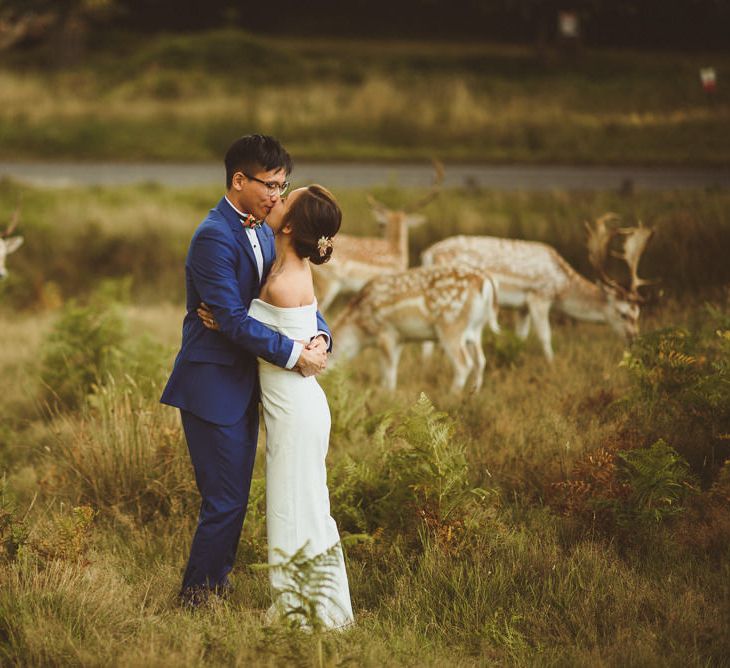 Bride and groom portraits with deers in the background