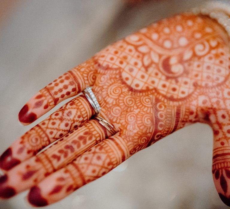 Henna painted hands on bride