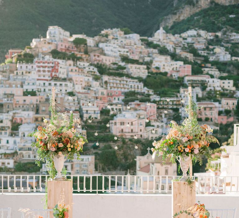 Outdoor autumnal coastal wedding ceremony at Hotel Marincanto for two brides