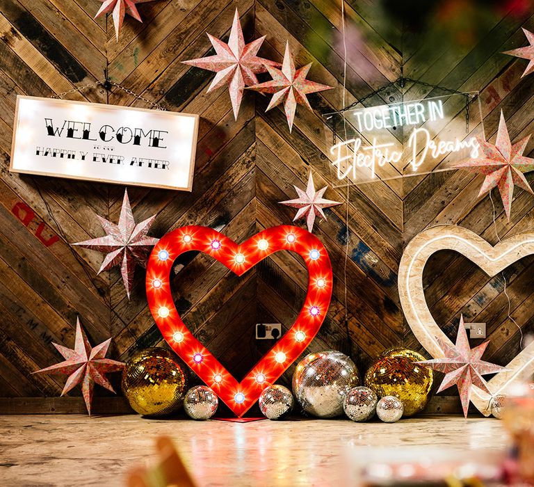 Neon wedding signs, disco balls and star decor 