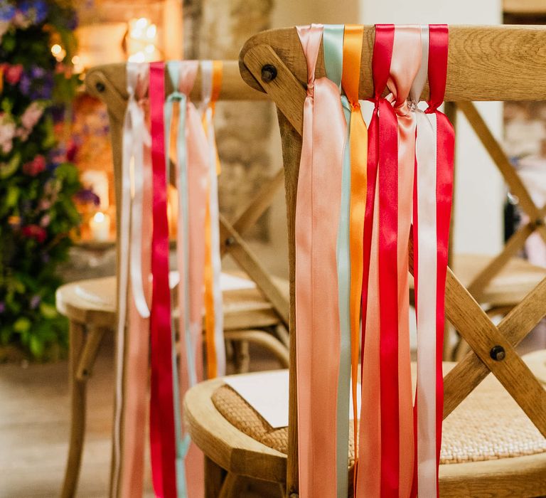 Colourful ribbon chair back decor at fiesta theme wedding 