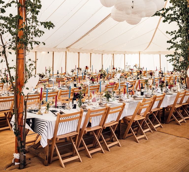 DIY marquee wedding with foliage decor and lanterns