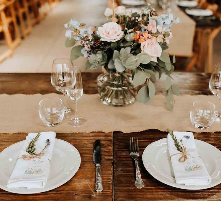 Rustic wedding place setting at barn venue with brass band wedding entertainment