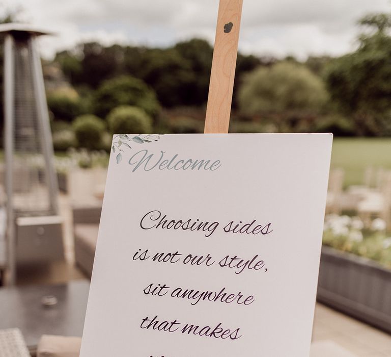 Personalised wedding stationery with sign stating people can sit anywhere during the ceremony | Joshua Gooding Photography