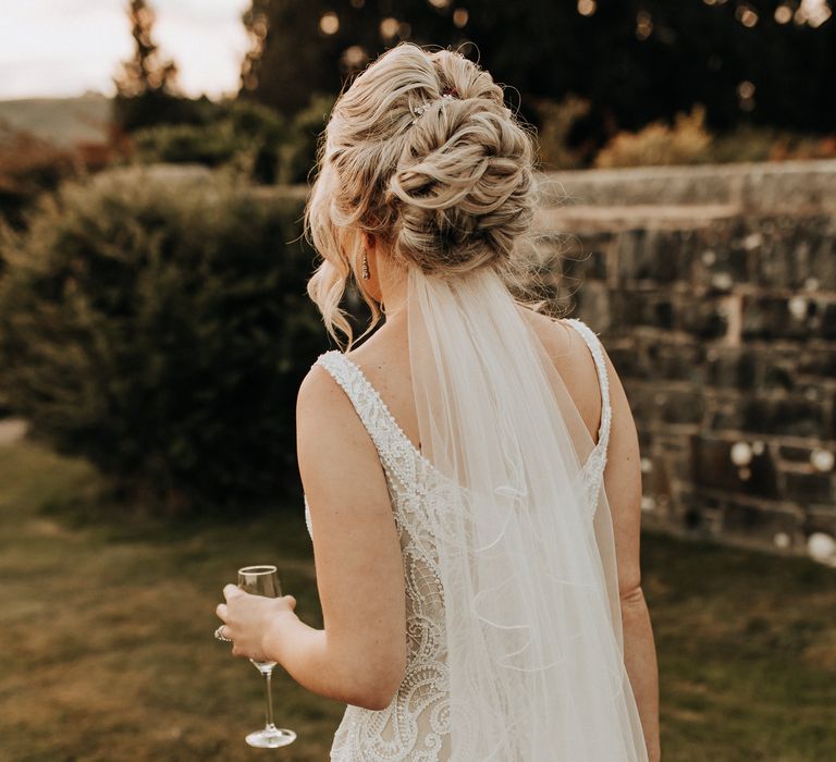 Pinned bridal updo with veil