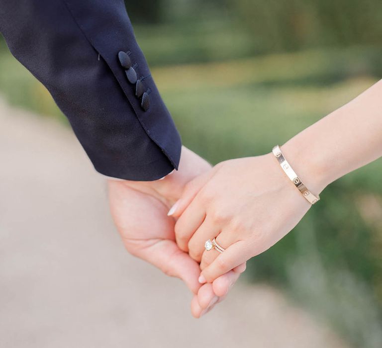 Bride & groom walk hand in hand after wedding ceremony