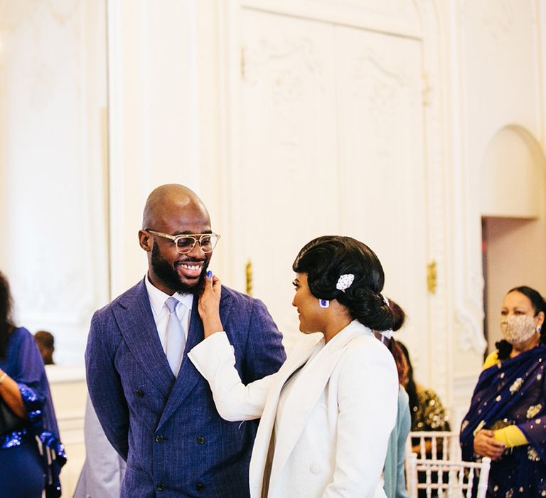 Bride & groom smile at one another on their wedding day