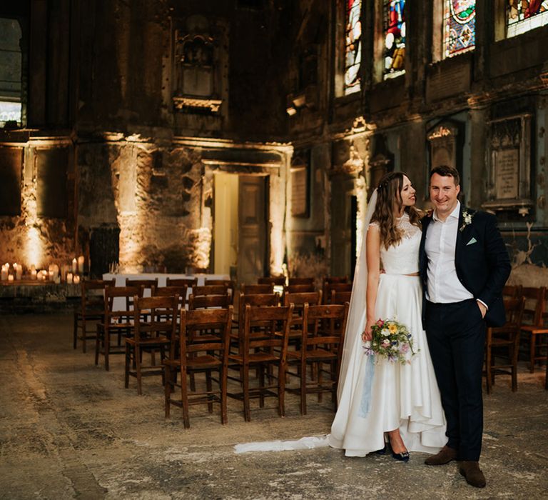 Bride and groom at industrial styled Asylum Chapel wedding venue 