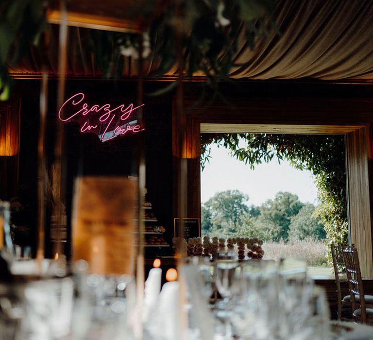 Pink crazy in love wedding sign at Elmore Court wedding reception