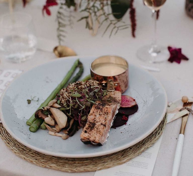 Dinner of salmon, mushrooms, asparagus and a sauce for the wedding reception