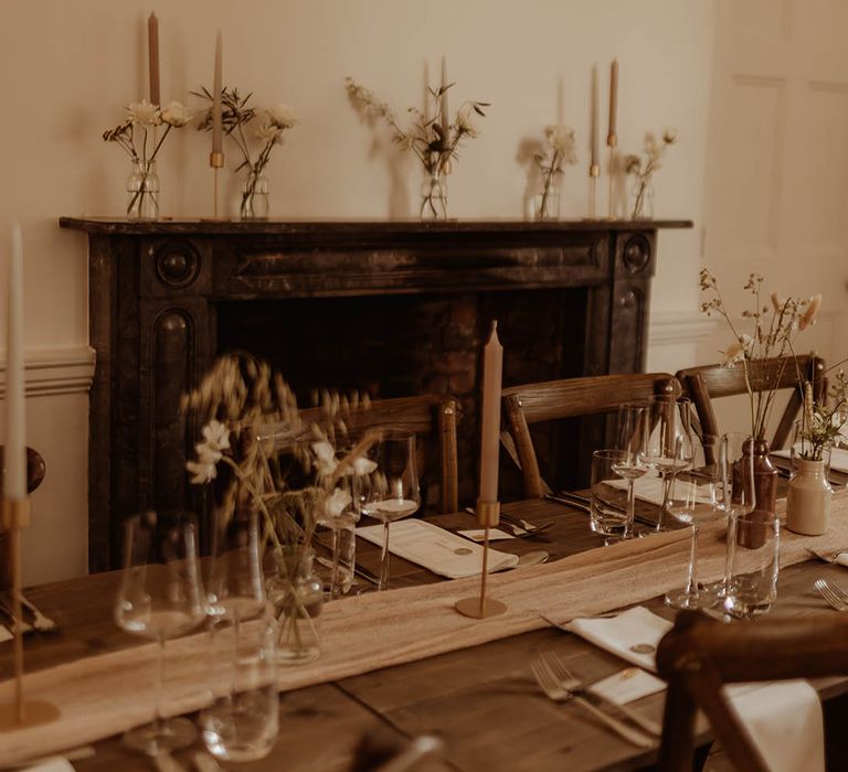 Minimal and simple decor for boho luxe wedding with bunny grass and other dried flowers and neutral coloured candles 