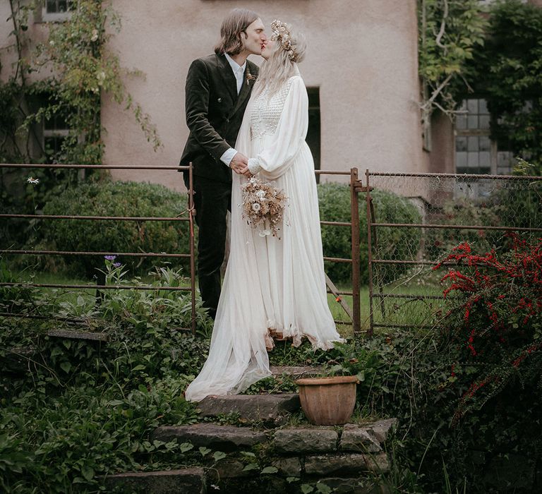 Bride wears crochet and ethereal styled wedding dress with dried floral crown with veil 