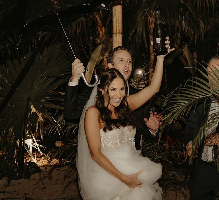 Bride & groom dane outdoors during rave wedding reception in Mexico 