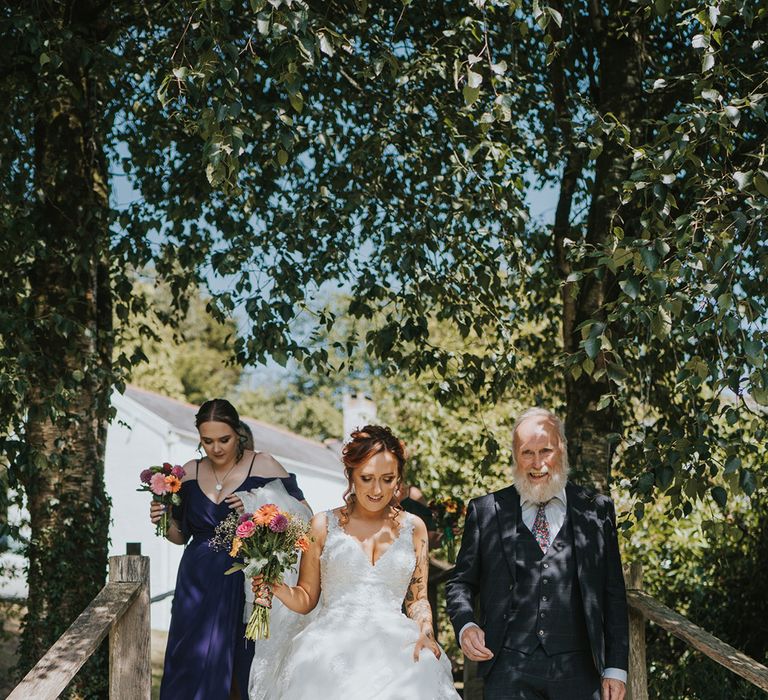 father of the bride with his daughter in a lace wedding dress at Devonshire wedding 