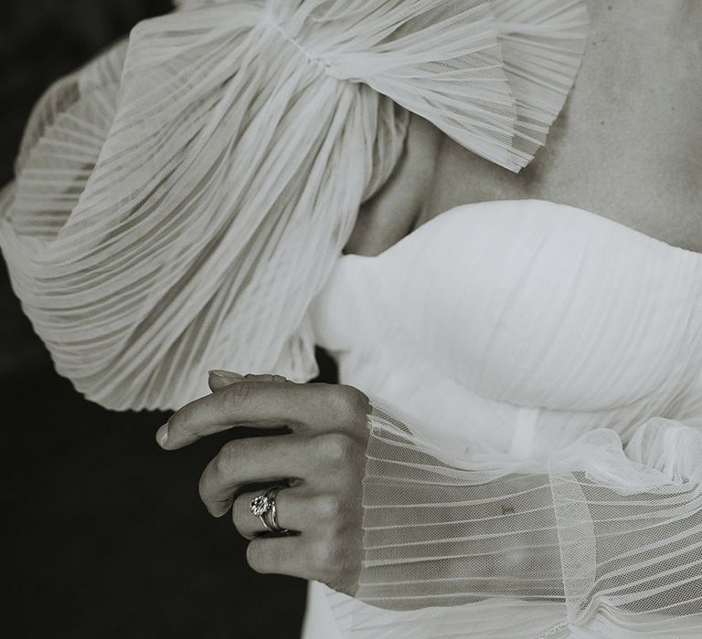 Bride wearing a strapless wedding dress with detachable sleeves 