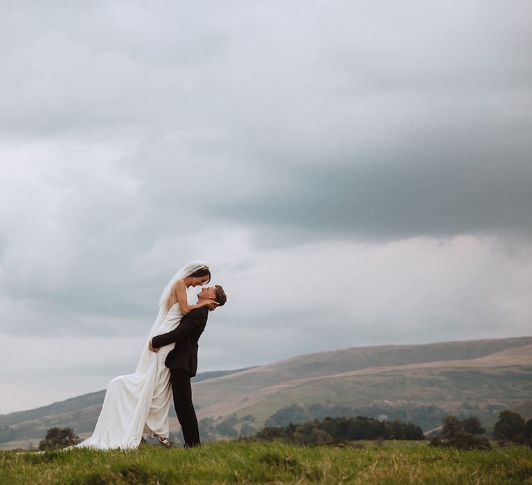 The bride and groom have romantic couple pose for wedding photos 