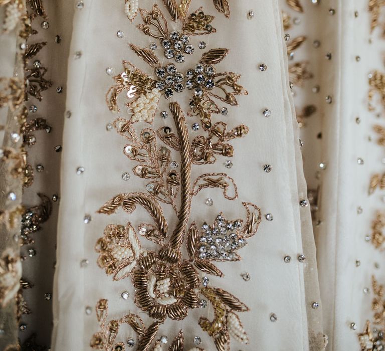 intricate gold beading on Indian/English wedding dress