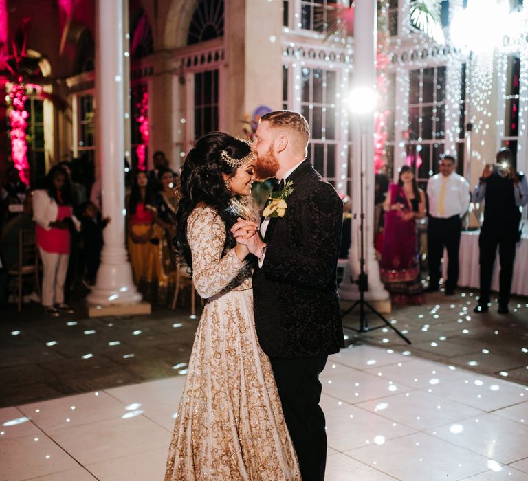 Bride and groom dancing at their Syon Park evening reception