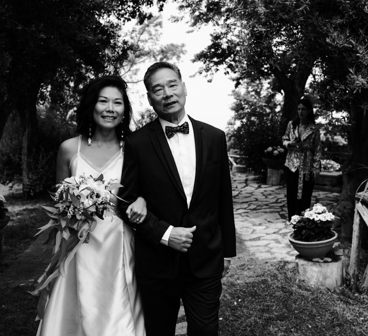 Father of the bride walking his daughter down the aisle 