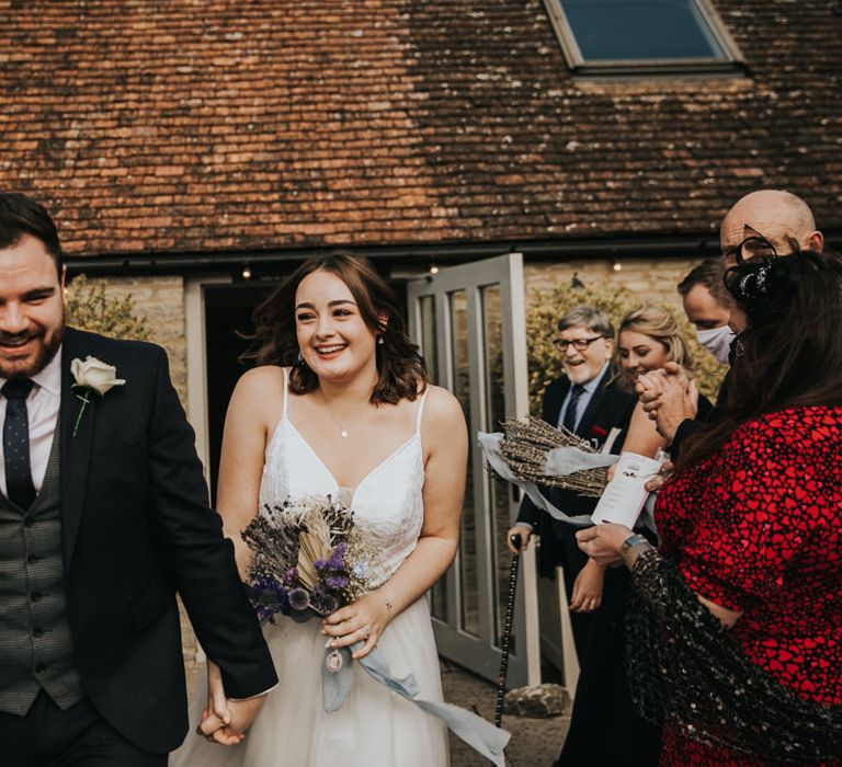 Laughing bride and groom just married