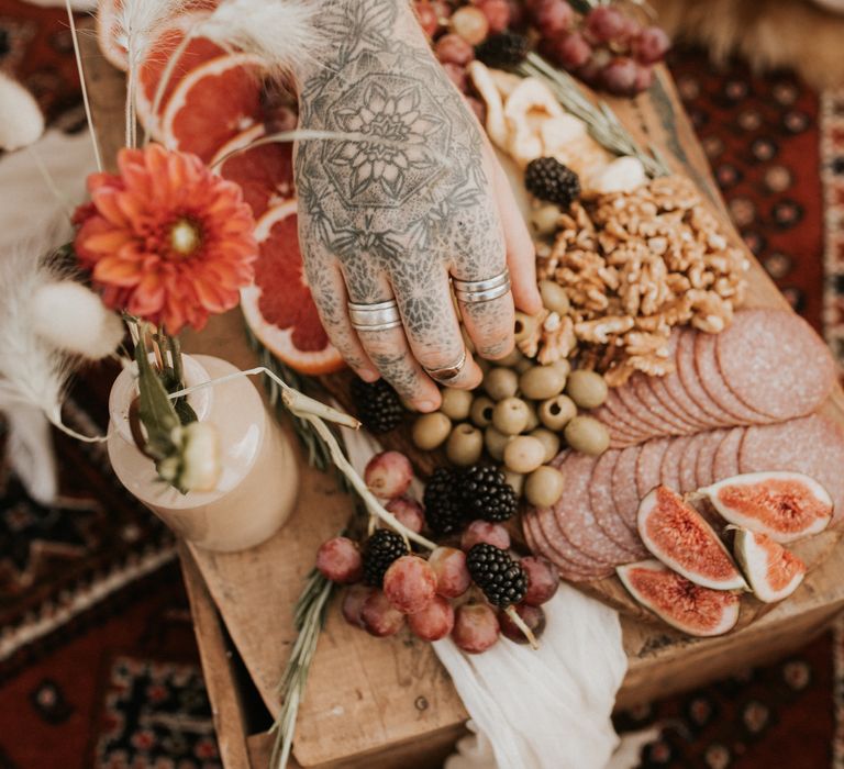 Grazing plate on top of wooden board for outdoor picnic