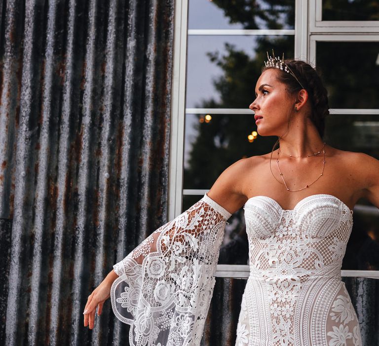 Bride wears lace gown in boho inspiration