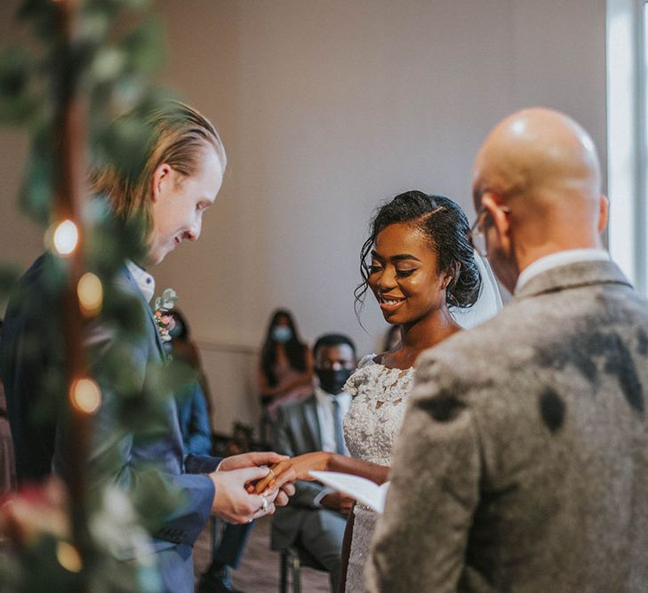 Groom putting on the wedding ring a the Heart Church, Nottingham intimate wedding ceremony 