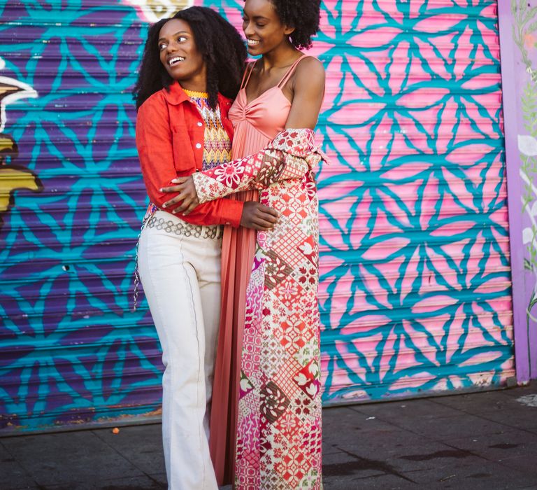 Vibrant San Francisco Engagement photos in front of graphic art