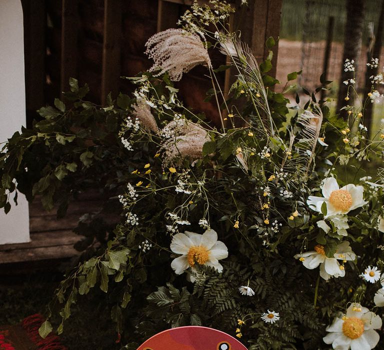 Love is a drug retro wedding sign and wildflowers for sixties wedding 