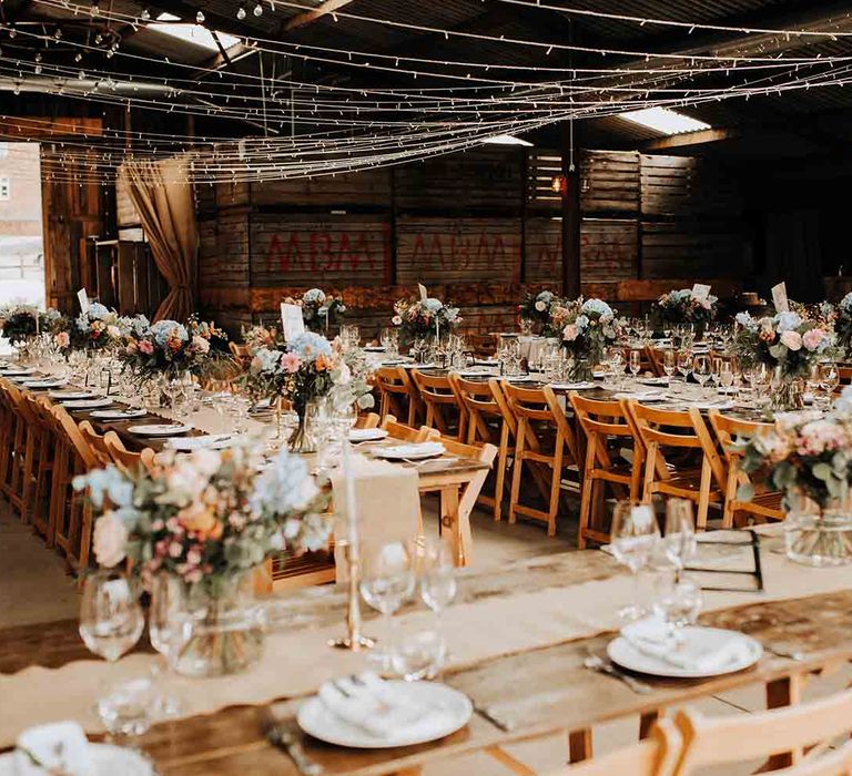 Rustic barn wedding venue with pastel wedding flowers